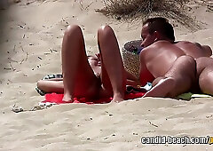 Shaved pussy MILFs tanning naked at the nudist beach (voyeur)