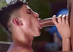 endowed man inserting his large, thick penis into the skinny boy's ass.