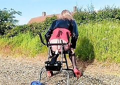 Crossdressing t-girl has her booty pounded by bang machine beside busy road