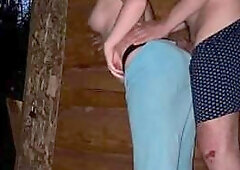 A preggo milkmaid is screwing a town stud outside a barn