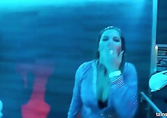 A horny guy is fucking a blonde bitch, while other people are dancing at the party