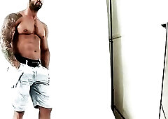 Sexy hunk latino jerking off during a photoshoot