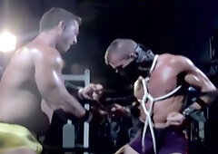 Muscular male slave is captive and set to endure merciless cock in ass