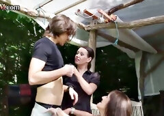 CFNM MILF cocksucking and wanking outdoors in 3some