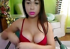 Asian shemale with perky tits licks her own monster dong