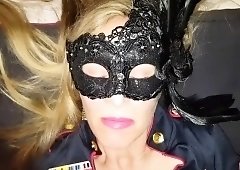 Masked blonde cougar in uniform blows a black cock in POV