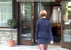 Cute playgirl with ebony hose, miniskirt and ankle boots.