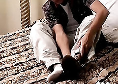 Hunk stretches his toes while stroking his meat