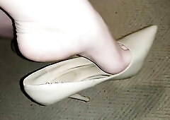 Shoeplay in tan heels. Dangling and dropping