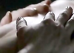 Olga Kurylenko wearing a watch-throughout purple top and some pants, showing pokey nipps throughout the thin shirt whilst in couch and standing at the