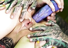 Tattooed cutie gets her booty filled with cum, compliment of alternative lesbos