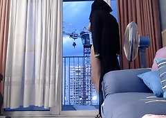 exhibits in niqab in front of a crane operator