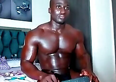 Black Guy Flexing and Posing In A Small Black Thong