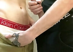 Two buddies pleasure their big cocks during a bathroom break