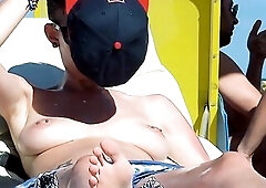 Youthful nudist girls secretly filmed by voyeur having joy at the beach