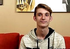 Cute blonde twink strips after an interview and masturbates solo