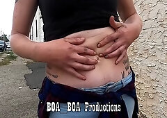 Belly button playing with tattoos