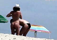 Exposed hotties on the beach.