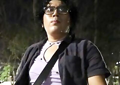 Crossdresser walking at night.