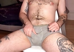 Hairy skater dude with tattoos gives himself a slick handjob and unleashes his load