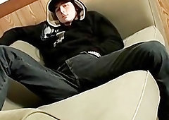 Dashing twink in a hoodie tugs on his big cock