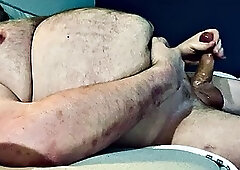 FAT DADDY STROKING HIS THICK UNCUT COCK ON THE COUCH