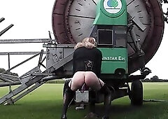 Wicked Tgirl Gina Trent riding a sex tool on farm equipment out in the field