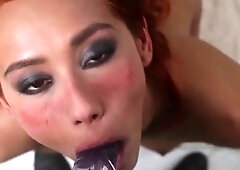 Kinky redhead has fun with a dildo and gets covered in cum