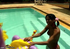 Cheerful teen 18+ shemale shows off sexy ass in thongs poolside