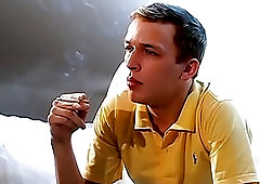 Attractive young man smoking solo and stroking his big cock
