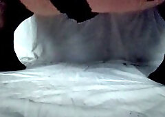 Crossdresser stroking in seductive lace shorts, panties, gloves, and stockings