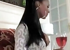 Beautiful ebony shemale slobbers on a big white cock passionately