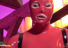 She-Creature in Crimson Spandex is Prepped to Predominate you with her Firm Lollipop