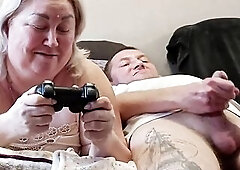 This guy interrupted his stepmom's game on the console, banged her in her throat and finished in it