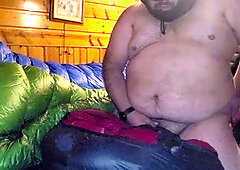 Chubby guy in a hood crushes a bag with a satisfying climax.