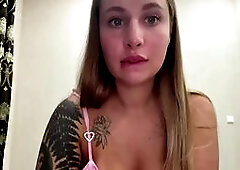Tattooed Blonde Teases in Pink Top