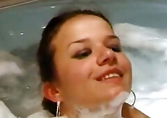 Sexy brunette MILF with nice tits gets fucked in Jacuzzi