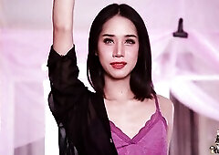 This skinny Oriental trans woman in purple underware positions on a pink canopy couch, showing off her body from multiple angles including standing, s