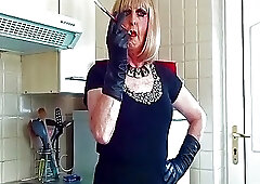 Glamorous Granny tranny Mandy smoking with sexy holder