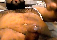 Hairy black man jerks off, showing off his chest and belly