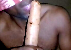 African lonely man suck a DILDO in his room