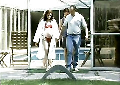 Wicked and preggy doll gets a ride on a large knob outdoors