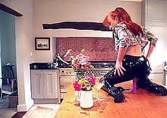 red xxx smashes herself with a toy while in latex pants
