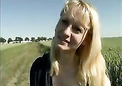 Blond teen disrobes in nature's garb outdoor
