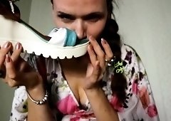 Seductive brunette babe enjoys the sweet smell of her shoes