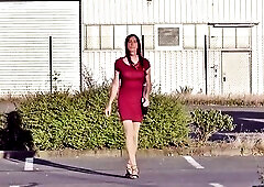 Ladyboy in mini-costume and high heels outside