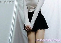 Crossdresser in Black Mini Skirt and Pantyhose