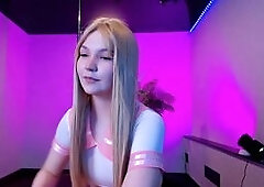 Blonde Femboy Teases in Pink Skirt
