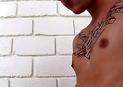 Tattooed young men jerk each other off before sensual blowjobs
