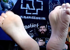 Bearded Metalhead Gamer Flashing Soles While Texting